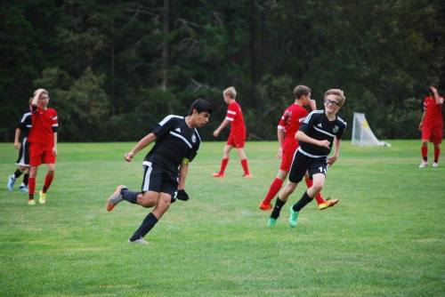 Aram Leyva (left) celebrates his goal.