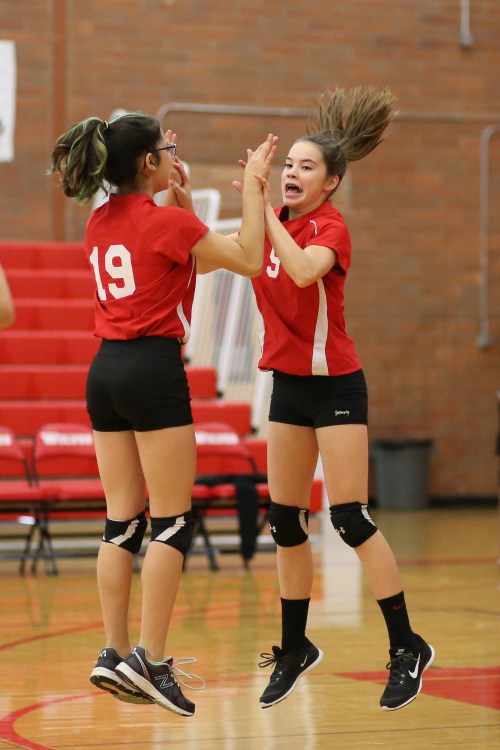 Raven Vick (19) and Maya Toomey-Stout celebrate