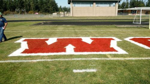 Lincoln Kelley hangs out next to the huge W