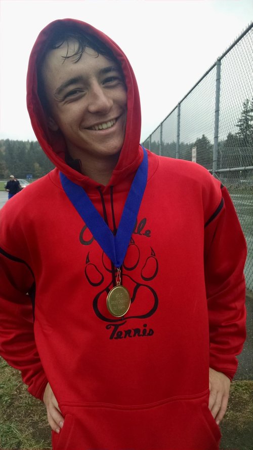 One medal to rule them all. Sebastian Davis rejoices in his singles championship at the 1A Olympic League tourney. (Joe Lippo photos)