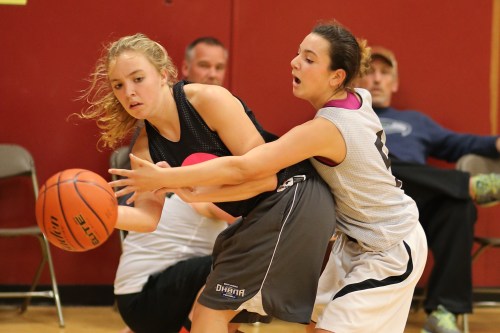 Wolf freshman Kalia Littlejohn (righT0 applies defensive pressure during a fall ball game.