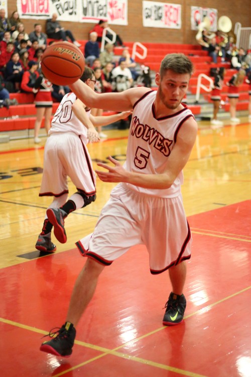 Jordan Ford, here hauling in a rebound, was one of the few bright spots for Coupeville Wednesday night. (John Fisken photo)