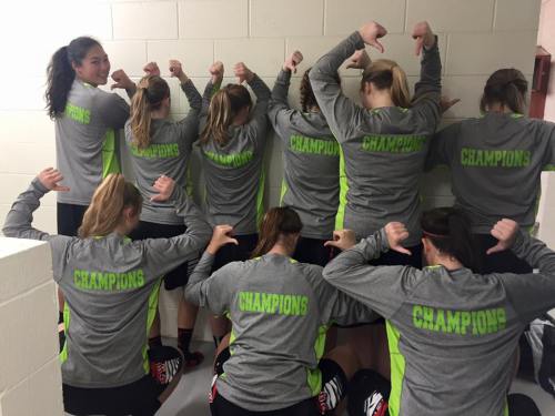 Makana Stone (far left) and teammates celebrate winning the Friday Harbor Tip-Off Classic. (Amy King photos)