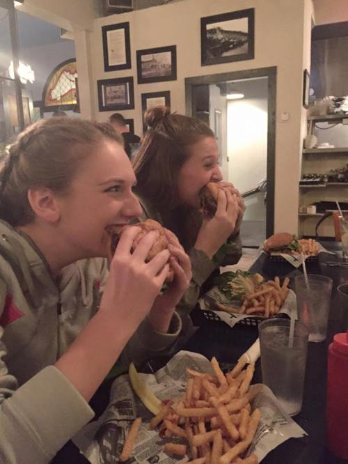 Lauren Grove (left) and Lindsey Roberts chow down after Friday night's win.