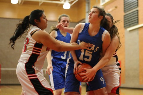 "Youse comes to Cow Town, we maybe roughs you up a bit, eh?" Brisa Herrera (left) and Sarah Wright (behind #15) administer a dang fine mugging.