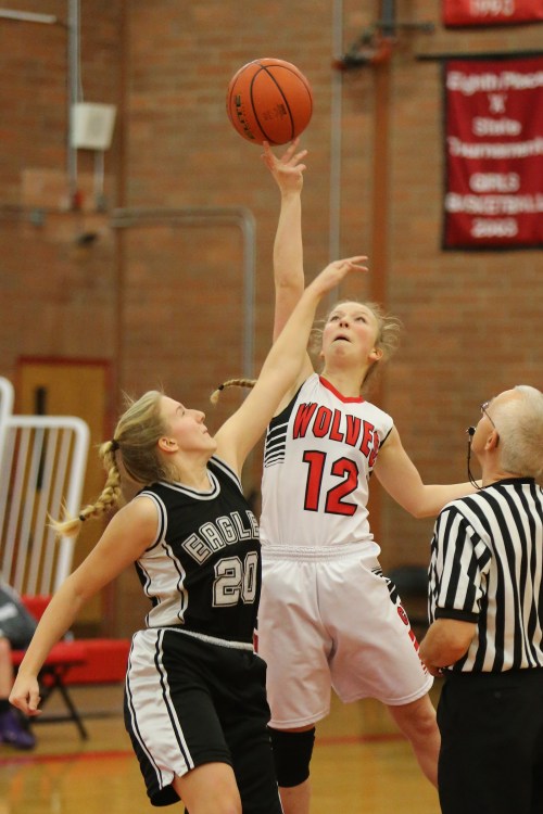 Allison Wenzel (right) seen here jumping center in an earlier game, went for a team-high 10 Tuesday at Vashon. (John Fisken photo)