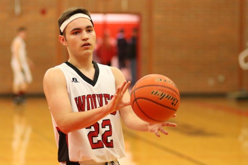 Senior JJ Johnson was electric Friday, dropping 19 in a win that clinched a playoff berth for Couepville. (John Fisken photo)
