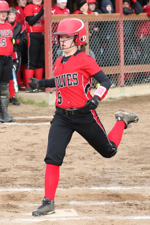 Lauren Rose stamps on home for one of the 33 runs scored Wednesday. (John Fisken photo)