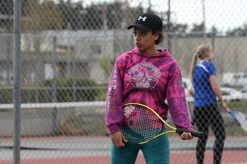 Kameryn St Onge knows, there's always time for air guitar between serves. Always.