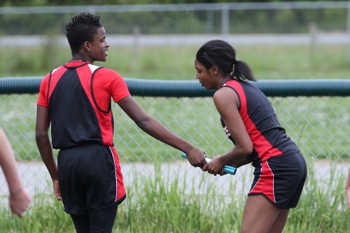 Jean Lund-Olsen (left) and Ja'Tarya Hoskins work on the relay hand-off. Sort of...