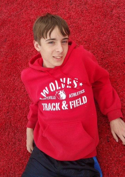Wolf frosh Danny Conlisk lounges on the red turf at Eastern Washington University. (Dawnelle Conlisk photo)