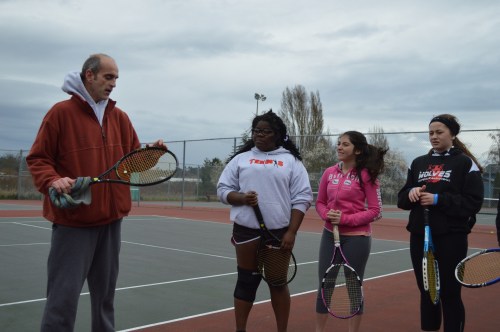 Borges and teammates Jazmine Franklin (left) and McKenzie Bailey listen to Wolf tennis coach Ken Stange during an early practice.