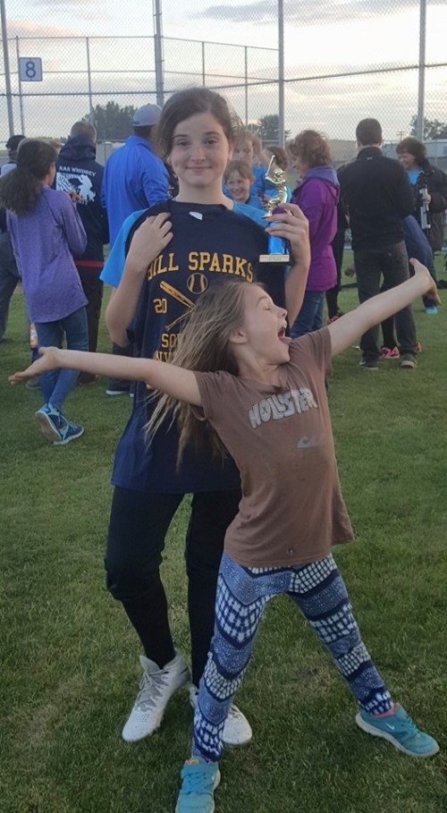 Kyle Van Velkinburgh, who whacked three hits in the championship game, gets photo-bombed by her fan club. (Dustin Van Velkinburgh photo)