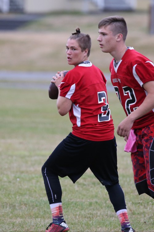 Topknot firmly in place, Wolf QB Hunter Downes comes out firing. (John Fisken photos)
