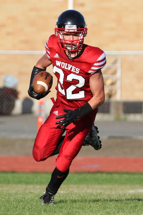 The future of Wolf football is a bright one, with Jake Mitten carrying the ball. (John Fisken photos)