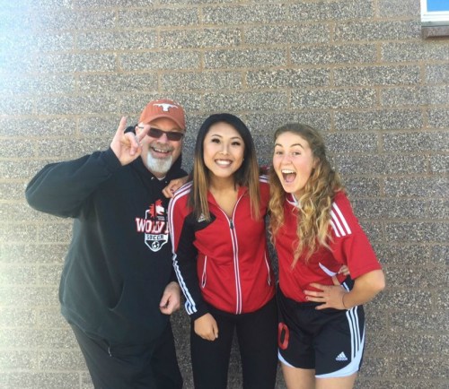 CHS soccer coach Troy Cowan celebrates a 5-1 win with Wolf stars May Rose (middle) and Bree Daigneault. (Photo courtesy Daigneault)
