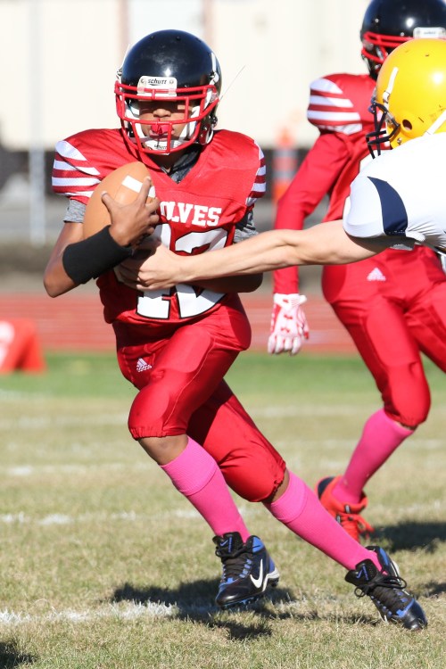 Dakota Eck tears off some yardage against Forks Wednesday afternoon. (John Fisken photos)