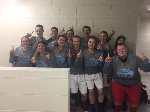 The Wolves celebrate the title in the locker room. (King photo)