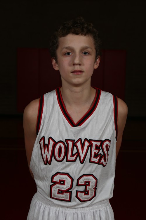 Aiden Juras swished a three-ball Friday, making him one of 11 Wolves to score in a boys JV win. (John Fisken photo)