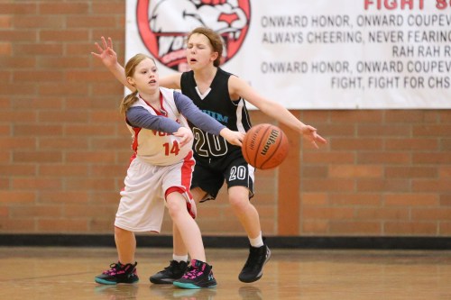 Lily Leedy makes the pass before the Sequim defender completely chomps her head.