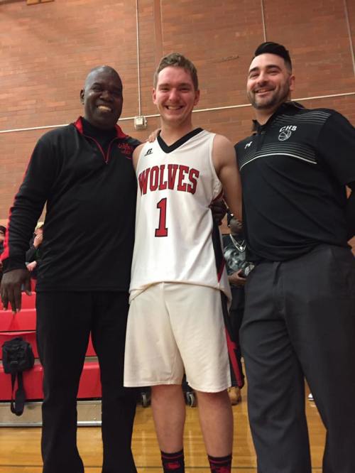Four-year varsity player Gabe Wynn shares a final moments with CHS coaches Anthony Smith (left) and Dustin Van Velkinburgh. (Robyn Myers photo)